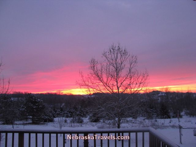 Beginning of Colorful Red and Blue Nebraska Midwest Country Sunrise sky - 7-34am