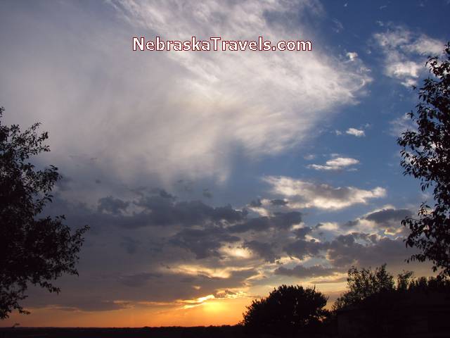 Sunset Photo with pink and yellow Colors with blue and white clouds - Eastern Nebraska Midwest country area