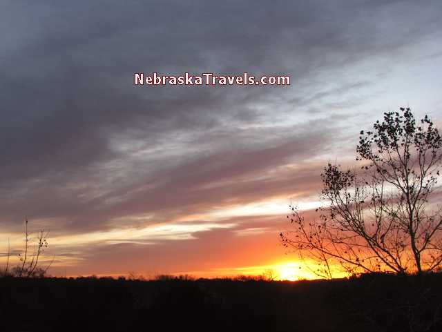 Colorful orange - red - sunrise clouds with dark blue sky - Nebraska Midwest country road - Sunrise Photo