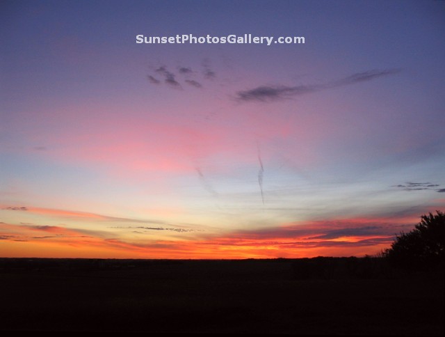 Sunset Photo with many Red - Oraange - Pink Color in cloudy dark blue sky - Midwest country area