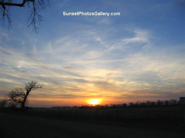 Colorful clouds - Red, orange and blue color sky - Beautiful Rural Sunset + one jet trail - Sunset Photos Gallery
