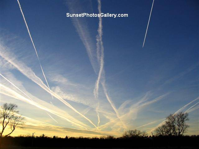 Nebraska Sunset Photos Gallery - Colorful blue sky with MANY jet trails - some "moving"