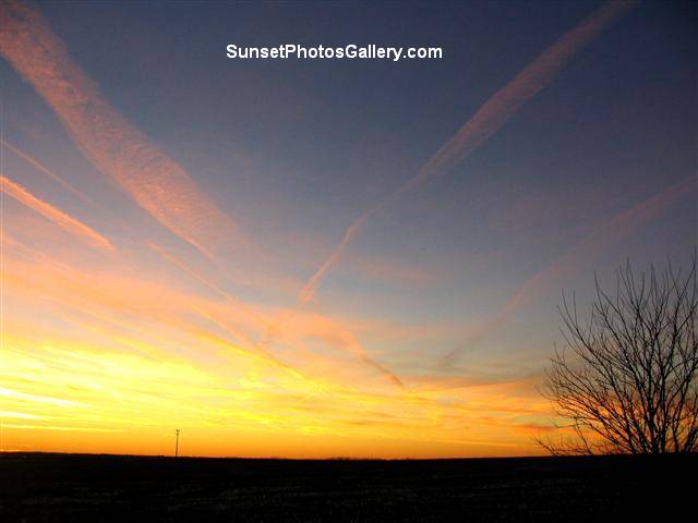 Nebraska Sunset Photo with Red Color Jet trails in dark blue sky - taken 27 minutes after above photo