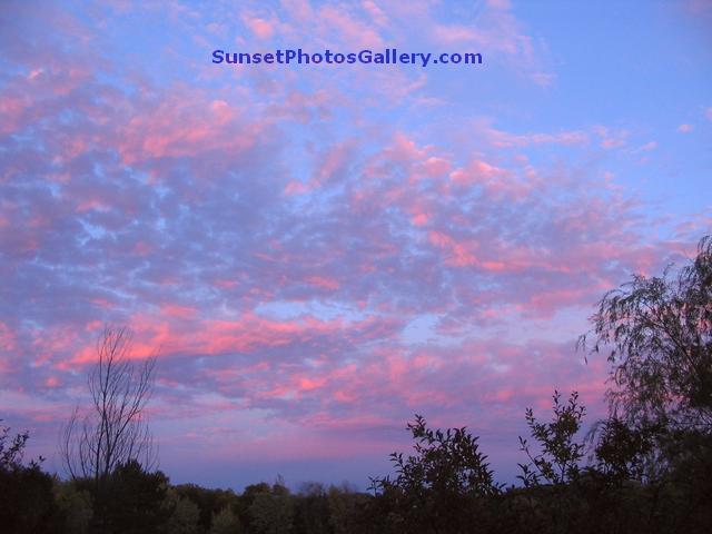 Sunset Photo with Pink Color puffy clouds in blue sky - Nebraska Midwest country area